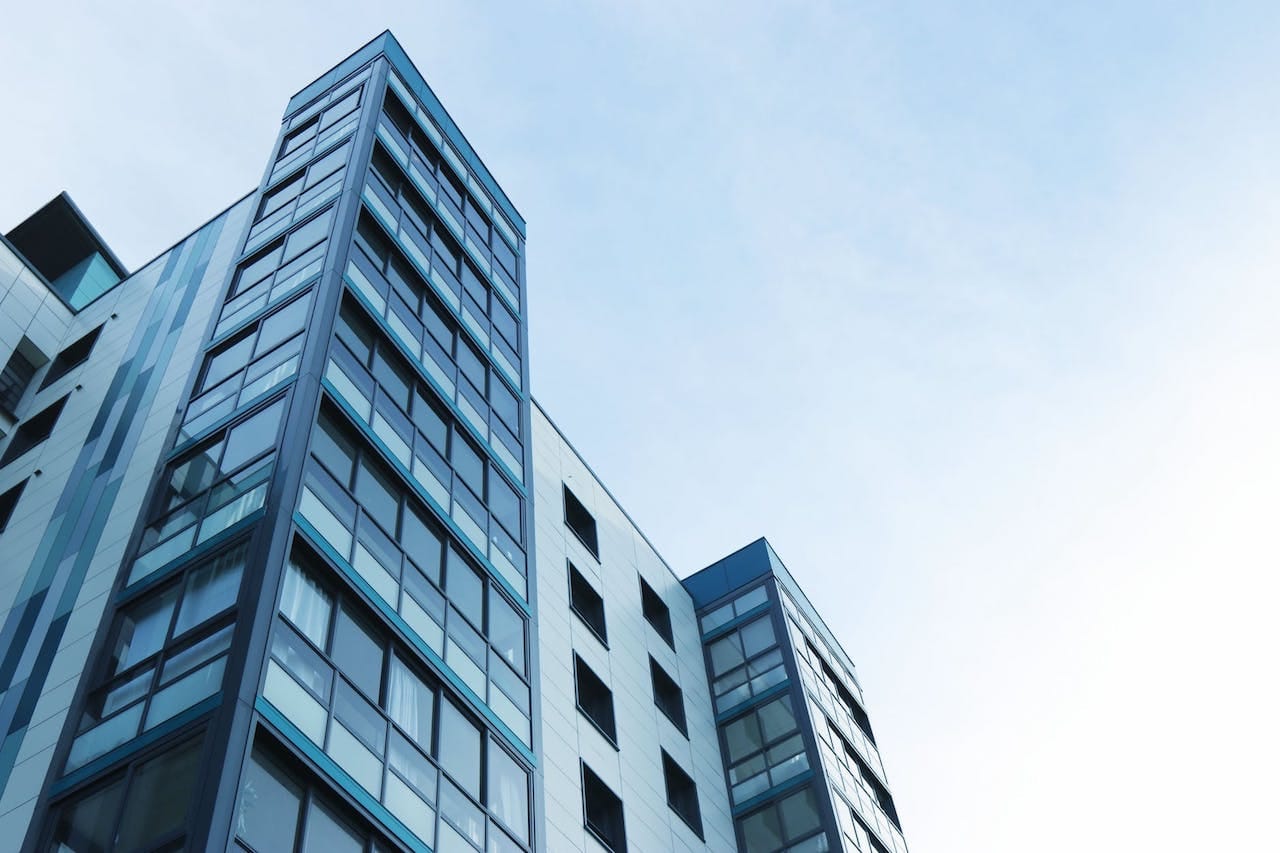 commercial building with blue skies behind it